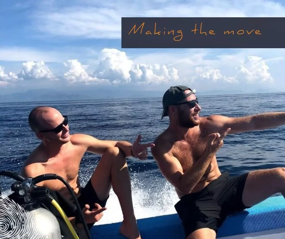 happy divers on dive boat