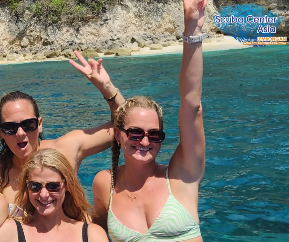 scuba girls on the boat after diving
