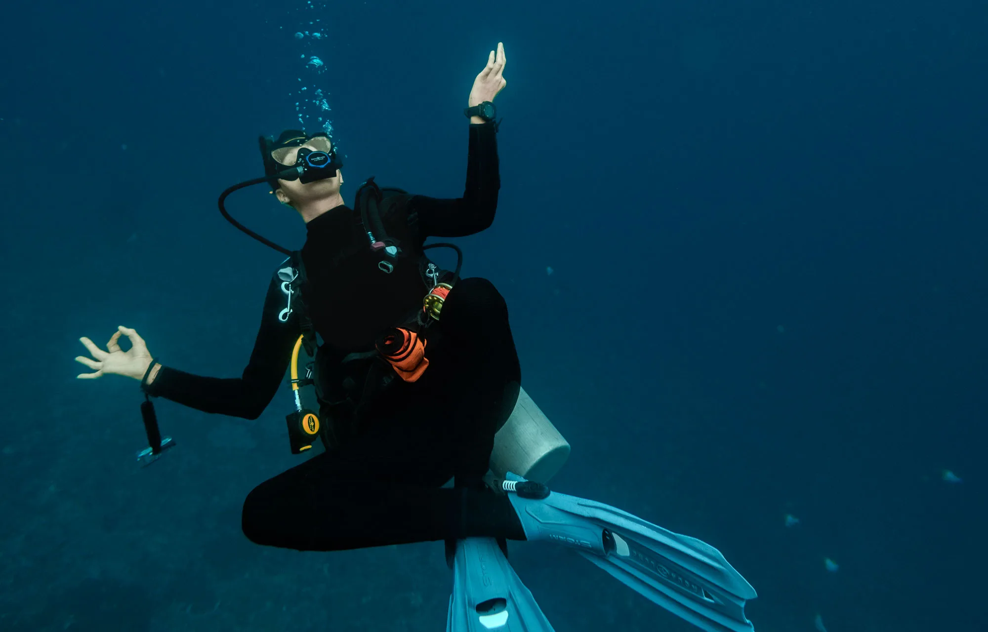 The PADI peak performance buoyancy specialty course at Scuba Center Asia teaches you perfect trim at any condition like this diver shows underwater.