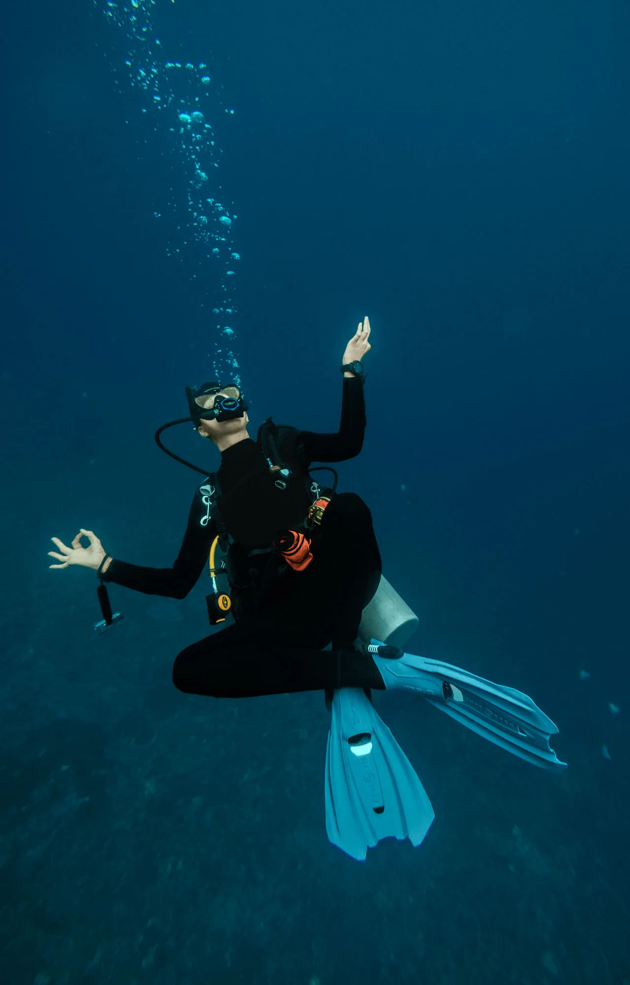 The PADI peak performance buoyancy specialty course at Scuba Center Asia  teaches you perfect trim at any condition like this diver shows underwater.