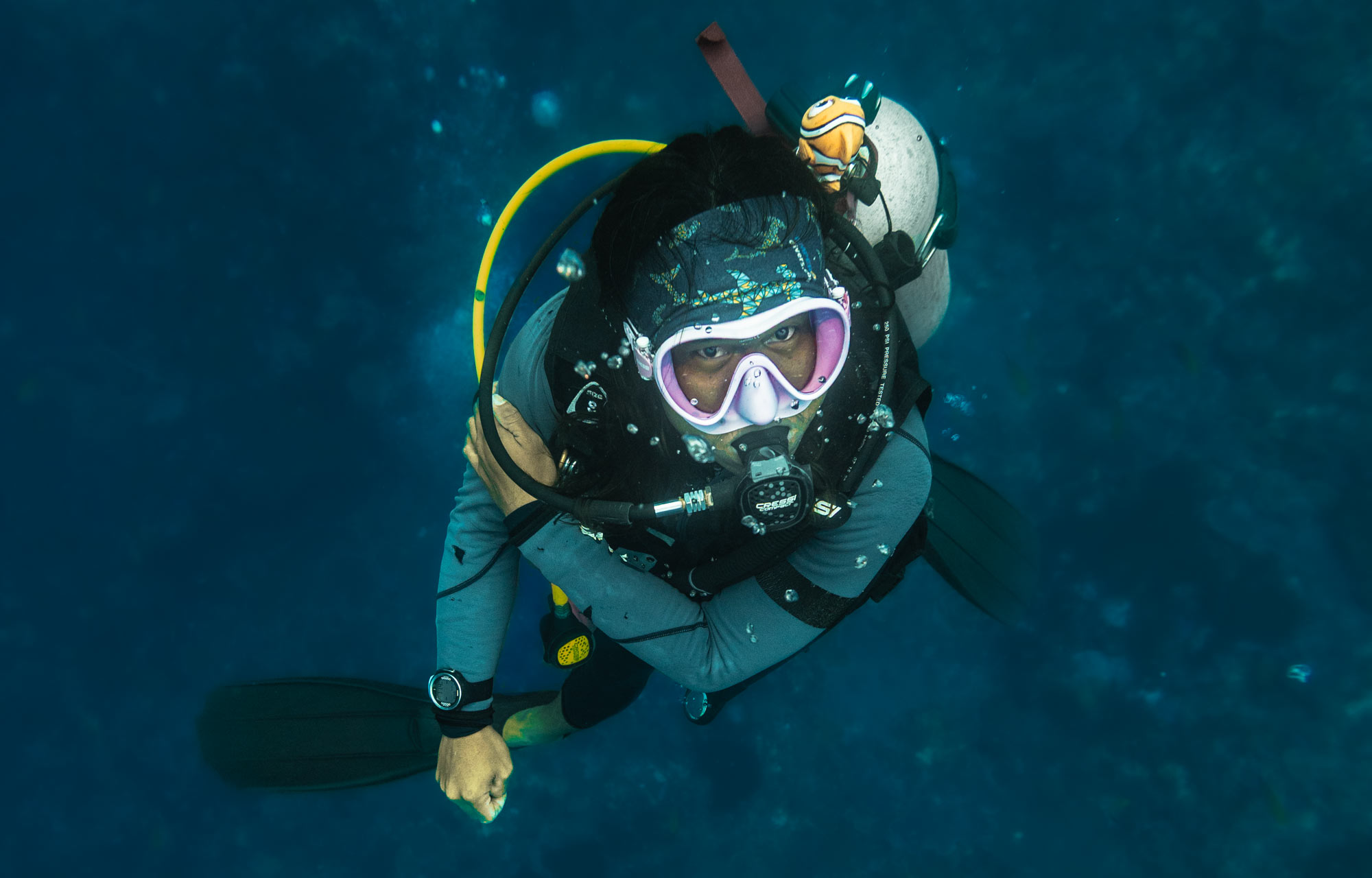 a diver exploring the depths of the stunning coral reefs of nusa penida marine park while doing the deep specialty at scuba center asia