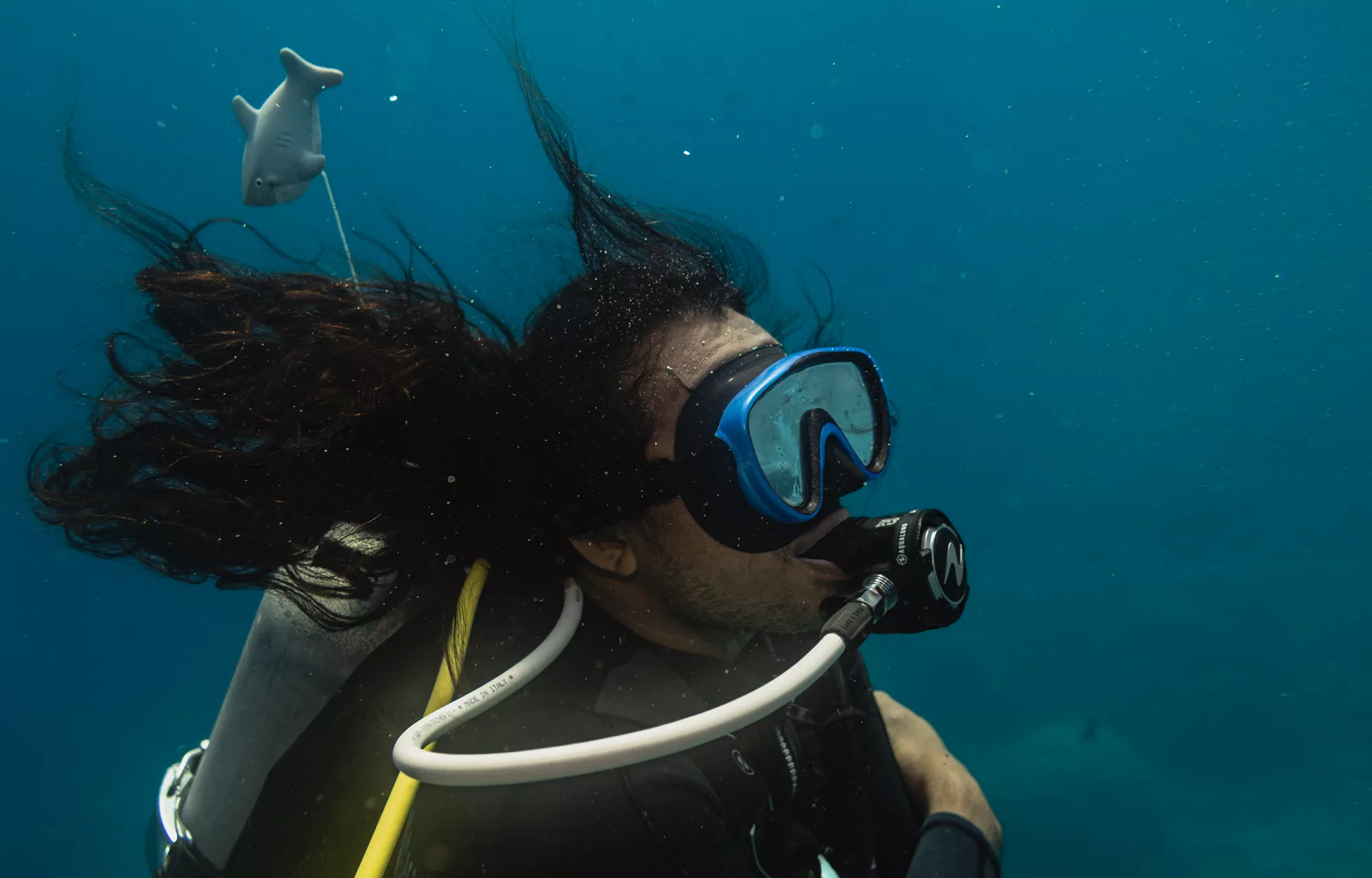 underwater shot of specialty instructor candidate demonstrating control