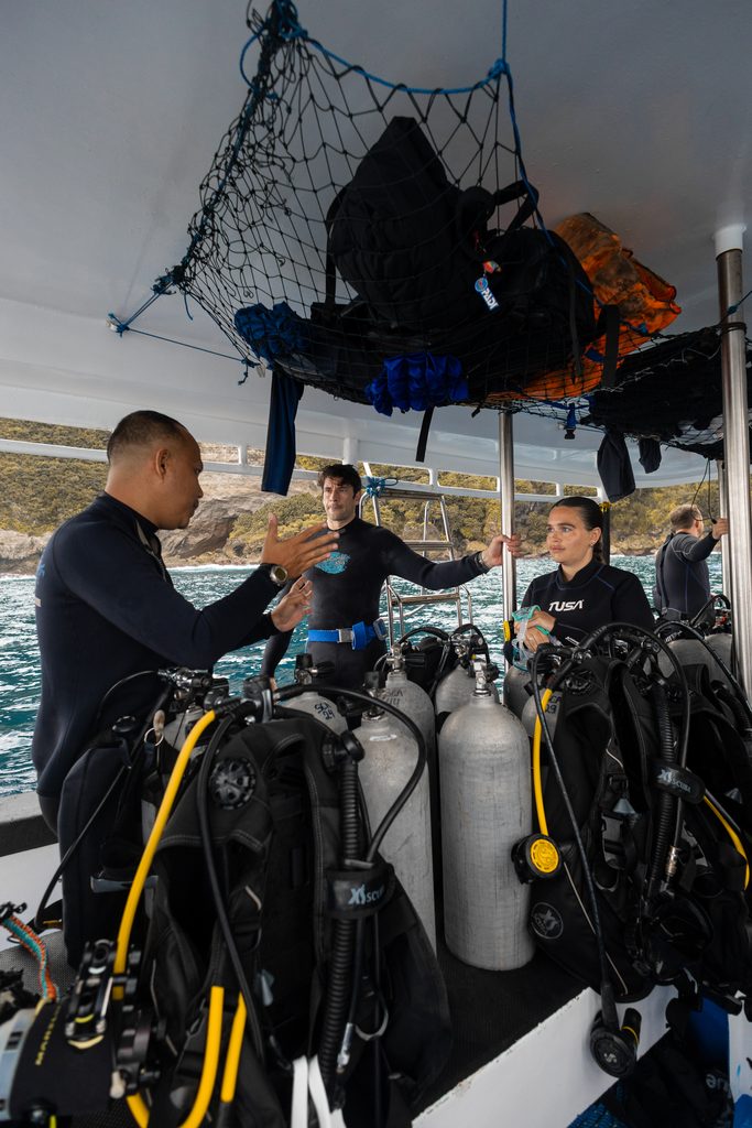 dive instructor gives 10-step briefing before the actual dive to his guests.