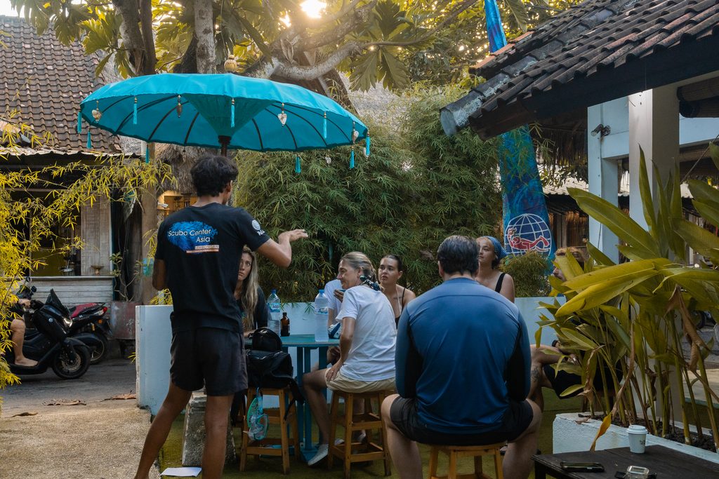 code of conduct briefing to dive groups at dive shop before going out diving